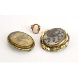 A 19th century yellow metal mourning ring inset oval cameo depicting a classical gentleman,