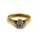 An 18ct yellow gold ring set single brilliant cut diamond in a six claw setting,