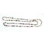 A semi-precious continuous bead necklace including jade, lapis lazuli, cloisonne, pearls etc., l.