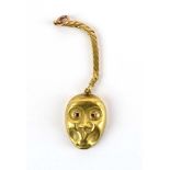 Mario Buccellati, an 18ct yellow gold charm in the form of a stylised face,