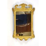 A George II-type giltwood fretwork wall mirror,