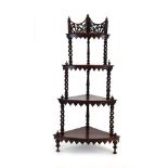 A 19th century rosewood corner what-not-stand with barley twist supports,
