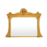 A George III and later giltwood overmantle mirror surmounted by a cherub and swag pediment,