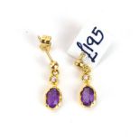 A pair of 9ct yellow gold ear pendants, each set a small diamond and oval amethyst, l. 1.6 cm, 1.