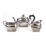 An early 20th century silver three piece tea service of canted form, maker R&D, Sheffield 1939,