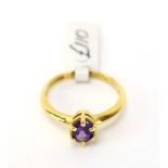 An 18ct yellow gold ring set oval amethyst in a six claw setting, ring size M, 2.