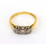 An 18ct yellow gold ring set three graduated diamonds in illusion settings, ring size P, 2.