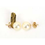 A pair of 9ct yellow gold ear studs, each set a single cultured pearl, pearl d. 9 mm, 2.