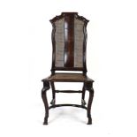 A 17th century walnut and caned chair with a serpentine splat and cabriole legs joined by a