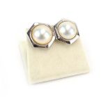 A pair of 18ct white gold ear studs of hexagonal form set pearl, w. 1.7 cm, overall 8.