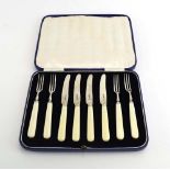 A set of four silver bladed cake knives and four cake forks with ivorine handles, maker JS&S,