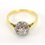 An 18ct yellow gold cluster ring set nine diamonds in a raised setting,