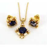 An 18ct yellow gold bead link necklace suspending a pendant set circular sapphire,