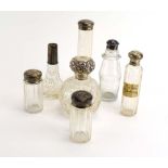 Seven silver mounted dressing table bottles,