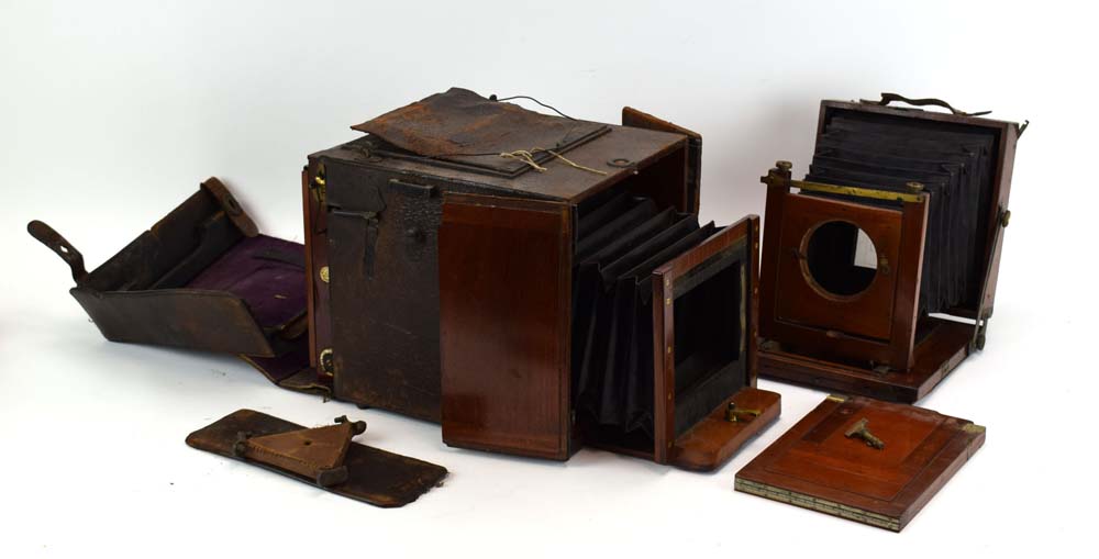 A Watson & Son mahogany and leather bellows camera,