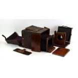 A Watson & Son mahogany and leather bellows camera,