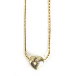 A 9ct yellow gold snakelink necklace suspending a two colour heart shaped pendant set small