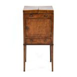 A George III mahogany washstand, the top opening into two parts to reveal a fitted surface,