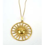 A 1970's 18ct yellow gold pendant of sun shaped form, marked verso RH within a hexagon, d. 4.