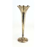 An Edwardian silver spill vase having a trefoil flute, Walker & Hall, Sheffield 1903, h. 23.