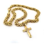 A 9ct yellow gold fancy link necklace suspending a yellow metal cross pendant set small diamond in