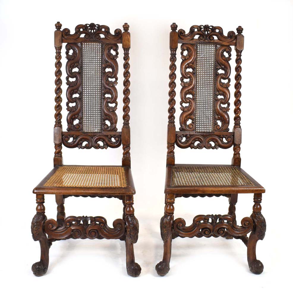 A pair of late 17th century walnut and bergere side chairs with bobbin turned supports, carved legs,