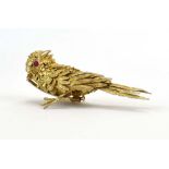 Jean-Claude Champagnat for Mecan Elde, a yellow metal clip in the form of a sparrow,