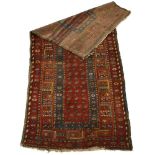 An early-to-mid 20th century runner, the red ground with blue and geometric bands and motifs,