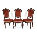 A set of three Victorian mahogany and upholstered highback side chairs on cabriole legs