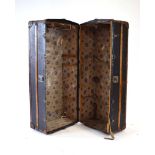 An early 20th century leather and beech bound gentleman's standing trunk, h.