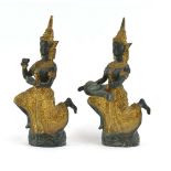A pair of Far Eastern green patinated and gilt decorated bronze figures modelled as a dancing