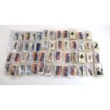 Forty-two sets of Players, Wills and Ogdens cigarette cards relating to military ships,