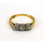 An 18ct yellow gold and platinum highlighted ring set three small graduated diamonds, ring size K,