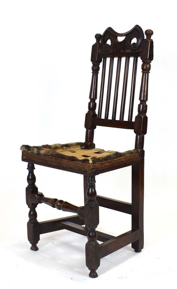 For Reupholstery: a late 17th century oak back stool with five spindles over a vacant seat,