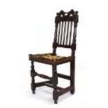 For Reupholstery: a late 17th century oak back stool with five spindles over a vacant seat,