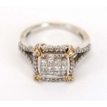 A 14ct white gold cluster ring set sixteen pave set princess cut diamonds within a border of