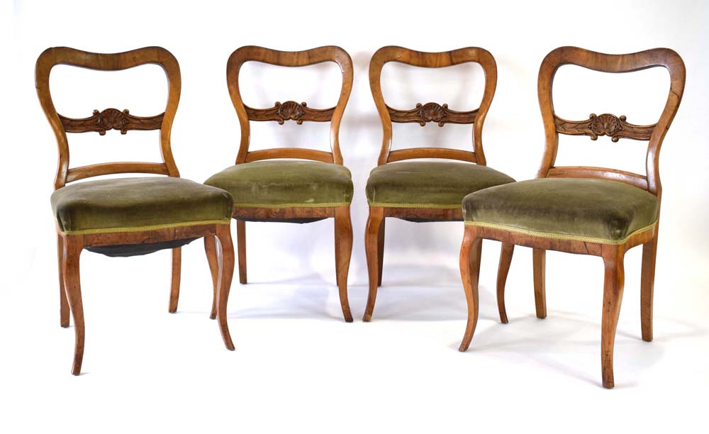 A set of four 19th century Continental walnut dining chairs on cabriole legs