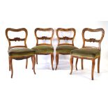 A set of four 19th century Continental walnut dining chairs on cabriole legs