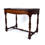 A 19th century oak buffet/silver table with a galleried surface over a shaped frieze,