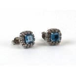 A pair of 18ct white gold ear studs, each set a cluster of blue topaz and small diamonds, setting d.