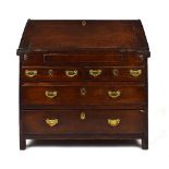 A late 17th/early 18th century oak bureau, the stepped interior with drawers,