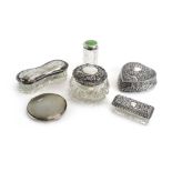 Five silver mounted dressing table containers and a circular silver engine turned compact,