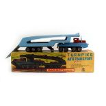 A boxed SSS International Mammoth Series tinplate Turnpike auto transport vehicle