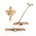 An early 20th century 9ct yellow gold pendant of Art Nouveau design set opal and peridot, l.