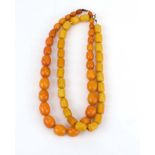 A graduated amber bead necklace, 43.