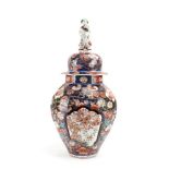 An 18th century Japanese vase and cover of octagonal baluster form,
