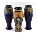 A pair of Royal Doulton stoneware vases of slender ovoid form,