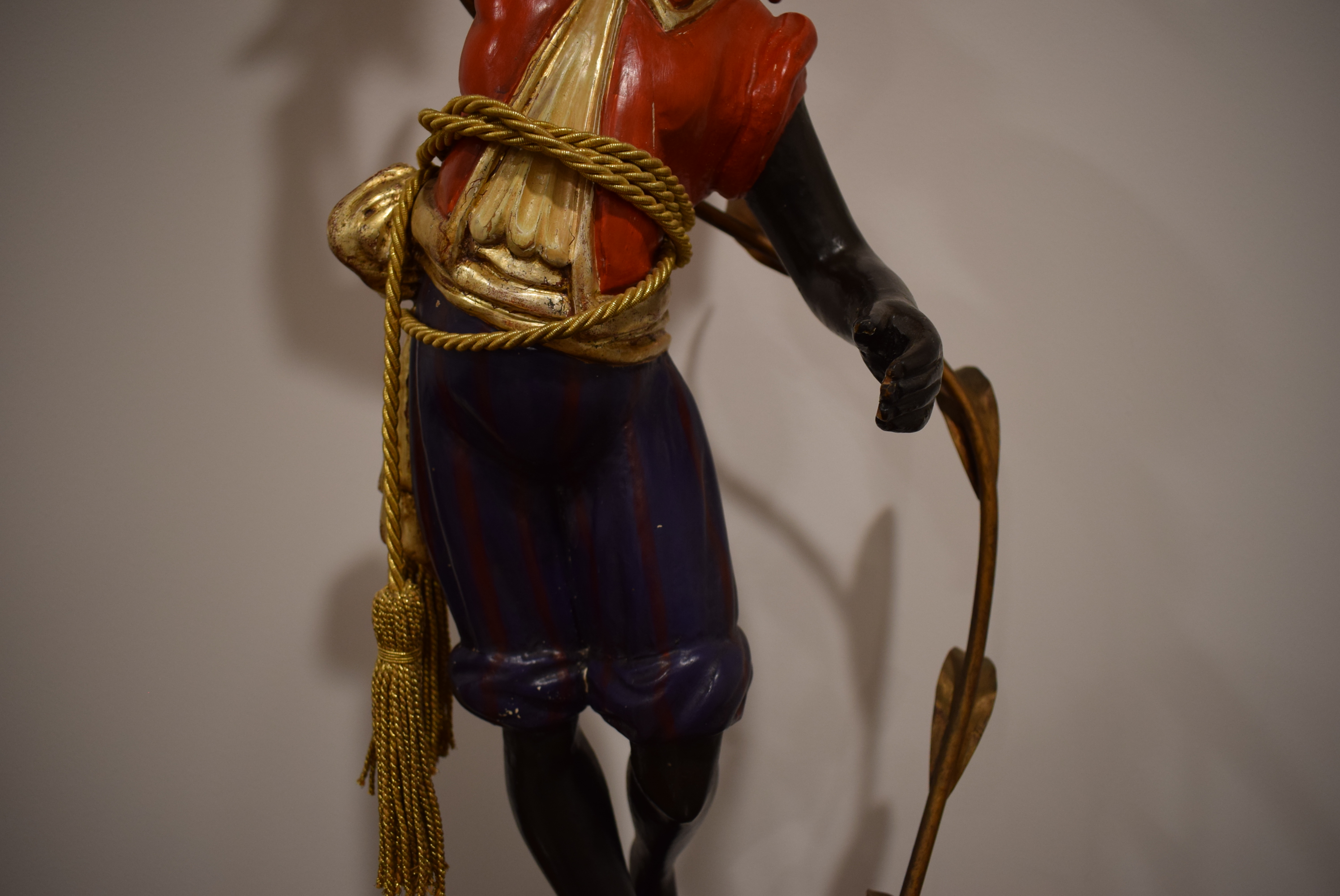 A polychrome and metalwork 'blackamoor' lamp modelled as a young man holding a five-branch foliate - Image 8 of 13