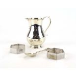 A silver cream jug of traditional form, London 1980,