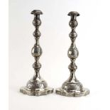 A pair of florally decorated silver candlesticks of knopped form, maker AT, London 1932,